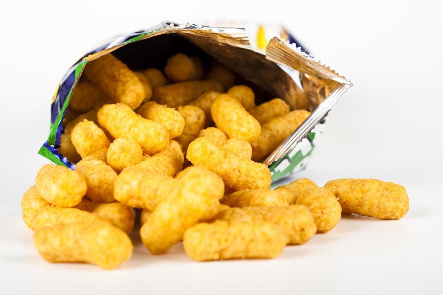 A bag of corn puffs is shown spilling out.