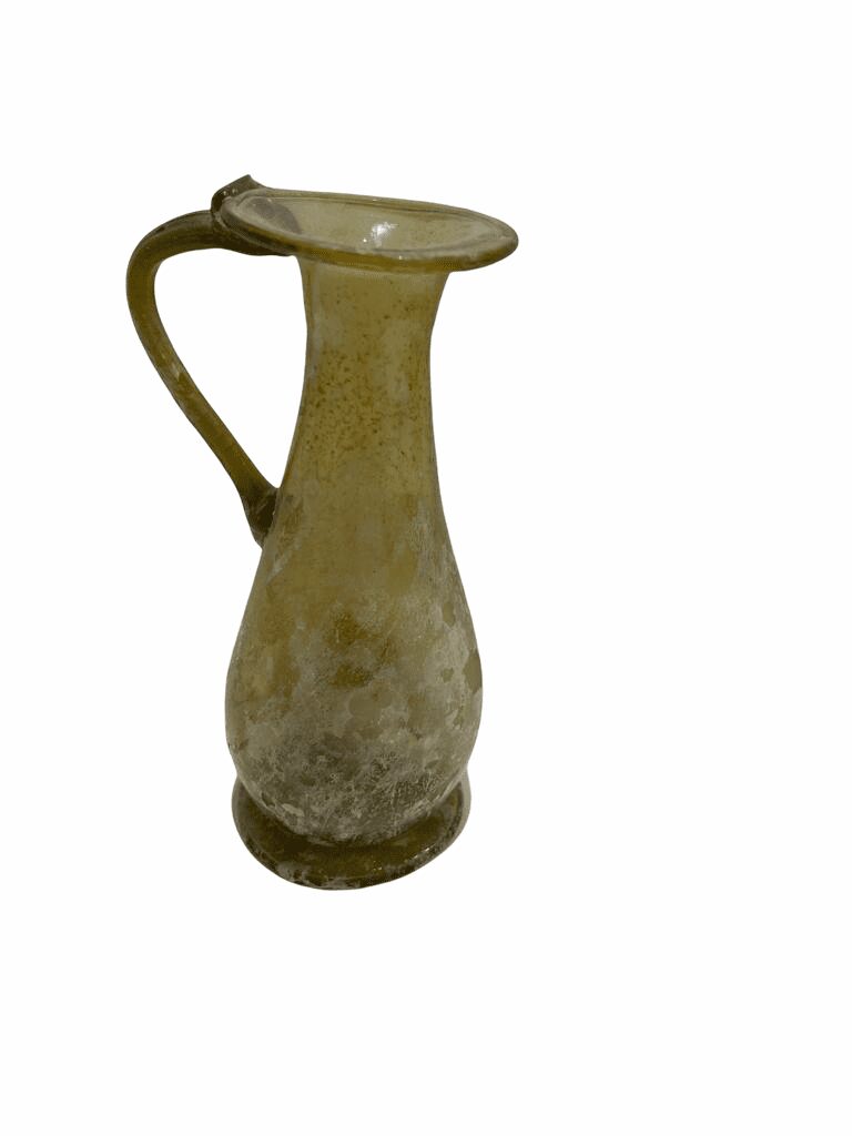 A brown vase with a handle on the side.