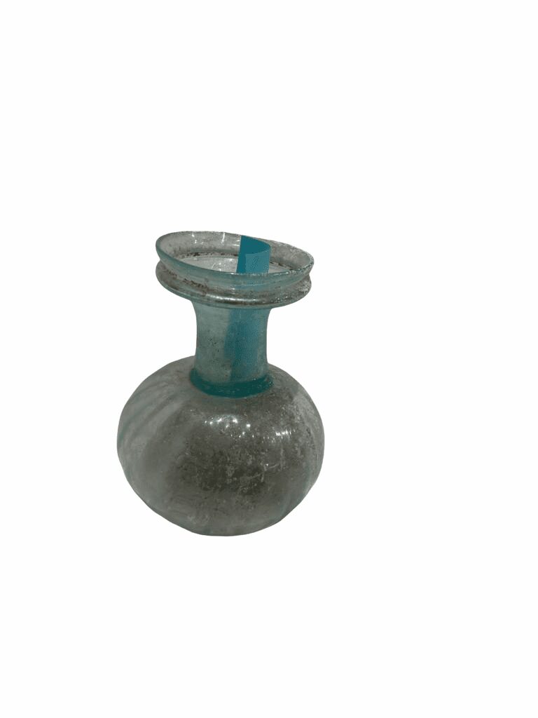 A small glass vase with a blue top.