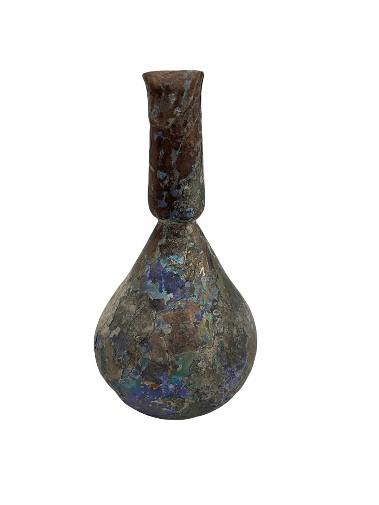 A vase with blue and brown paint on it.