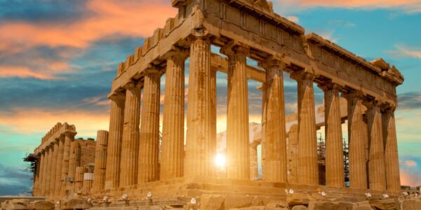 A sunset over an ancient greek temple.